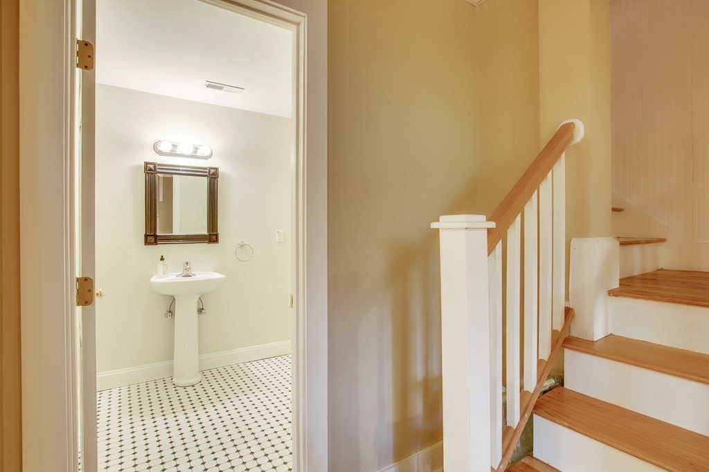 73 Weston Road Lincoln, MA 01773 - Photo 27 of 30 a bathroom with a sink and a mirror
