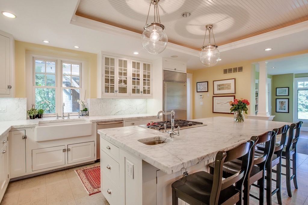 73 Weston Road Lincoln, MA 01773 - Photo 5 of 30 a kitchen with a table chairs stove and cabinets