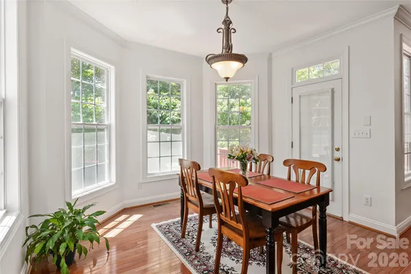 a kitchen with stainless steel appliances granite countertop a refrigerator a stove top oven a sink and dishwasher