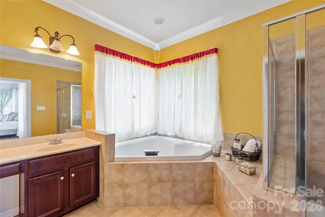 a spacious bathroom with a granite countertop tub sink and mirror