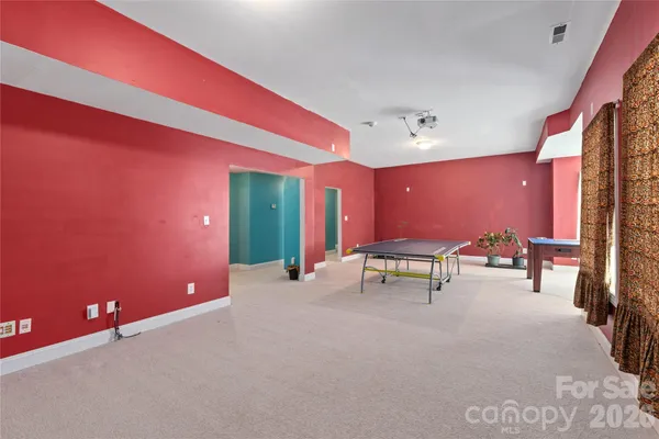 a view of a room with furniture and window