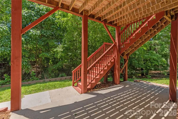 a view of a wooden deck with a yard