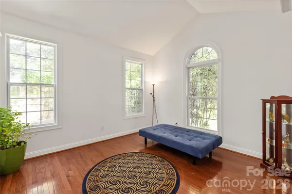 a view of a dining room with furniture wooden floor and chandelier