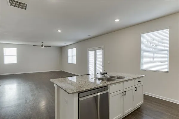 a kitchen with sink and window