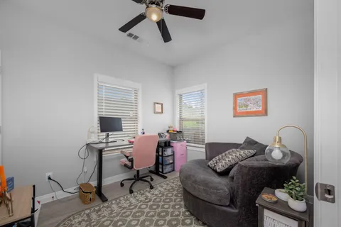 a living room with furniture and a window