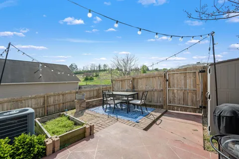 a outdoor living space with furniture and a fireplace