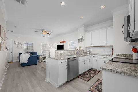 a kitchen with sink cabinets and window