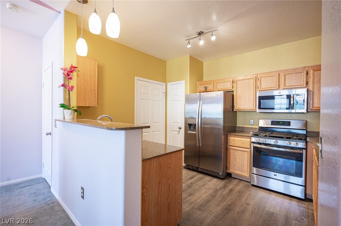 10550 West Alexander Road, Unit 2014 Las Vegas, NV 89129 - Photo 13 of 35 Culinary creations come alive in this well-appointed kitchen, featuring modern appliances and durable countertops.