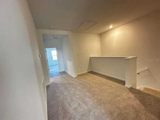 a view of an empty room and window