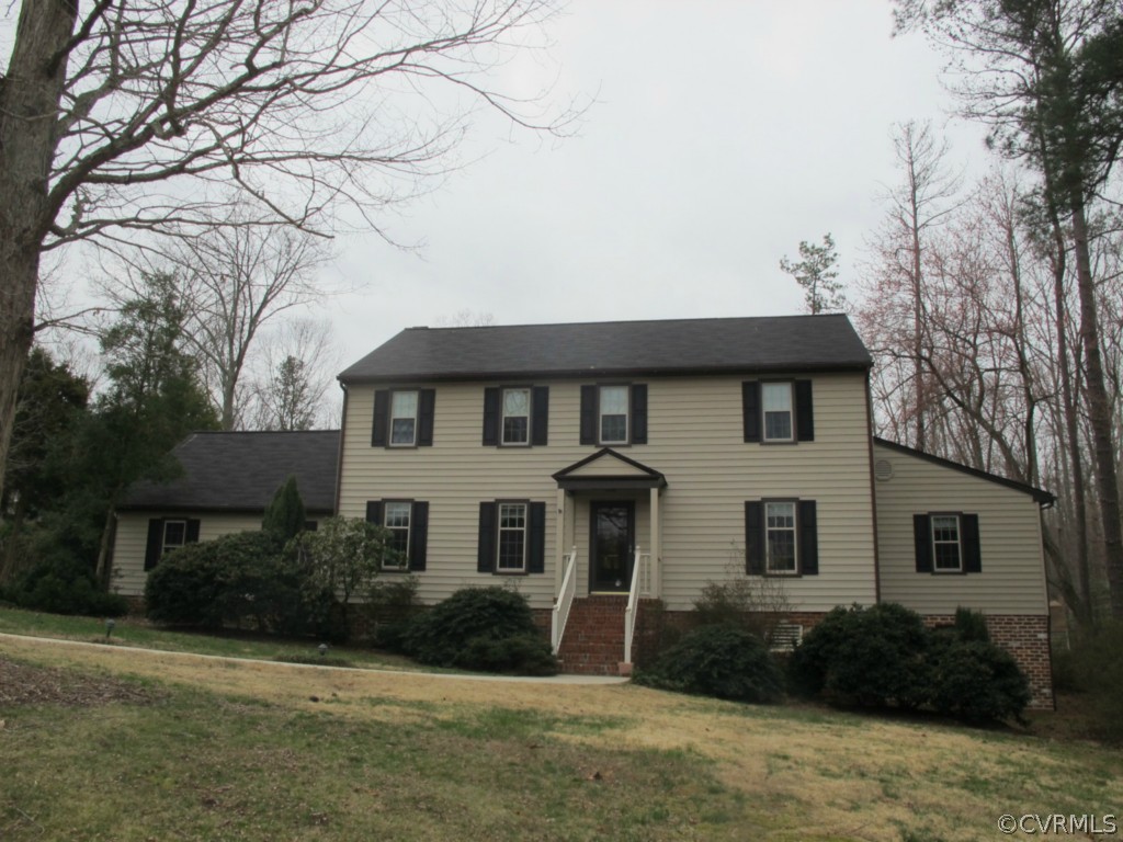 3815 Cresthill Road Chester, VA 23831 - Photo 1 of 24 a front view of a house with a yard