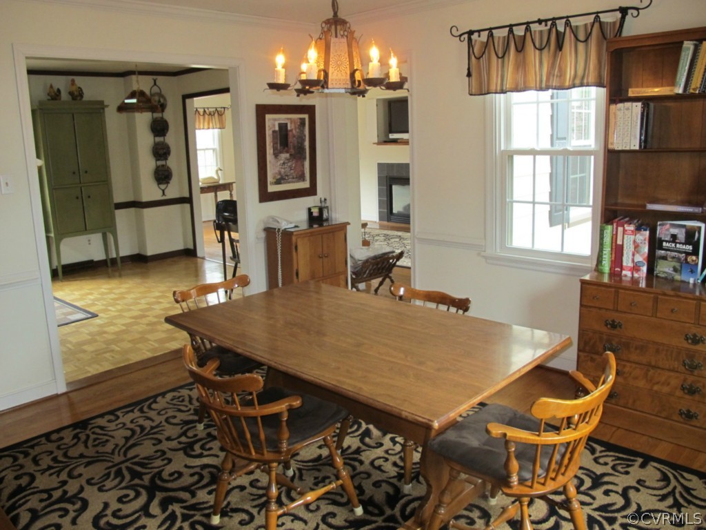 3815 Cresthill Road Chester, VA 23831 - Photo 11 of 24 a view of a dining room with furniture and a chandelier
