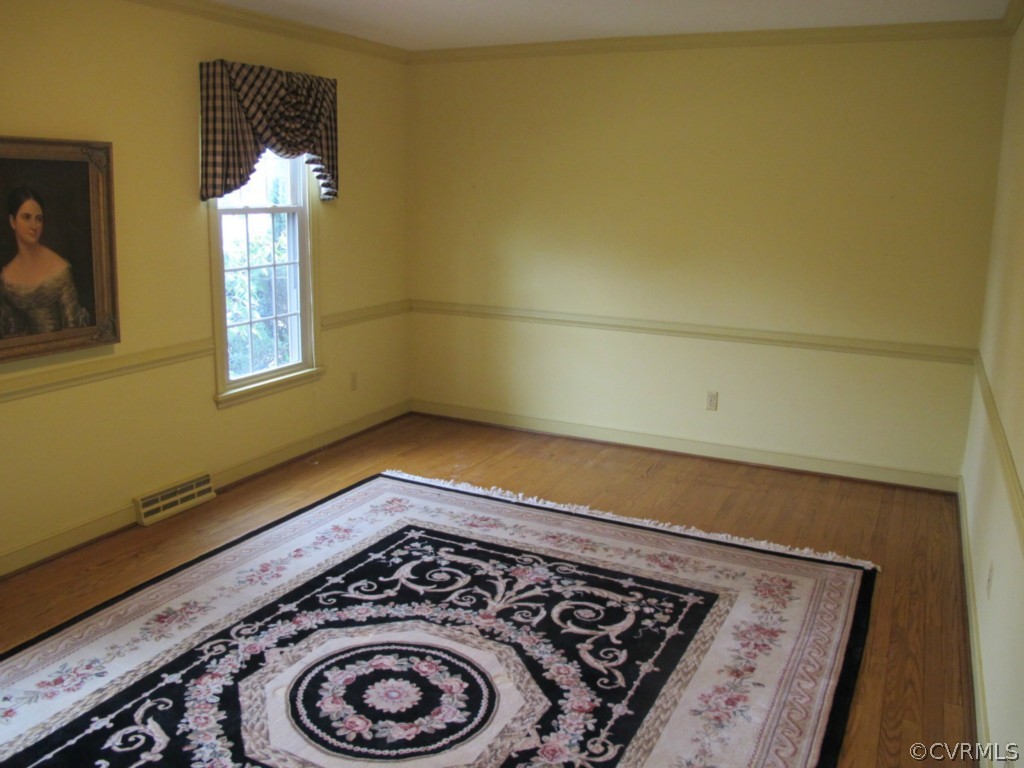 3815 Cresthill Road Chester, VA 23831 - Photo 5 of 24 view of a room with rack and wooden floor