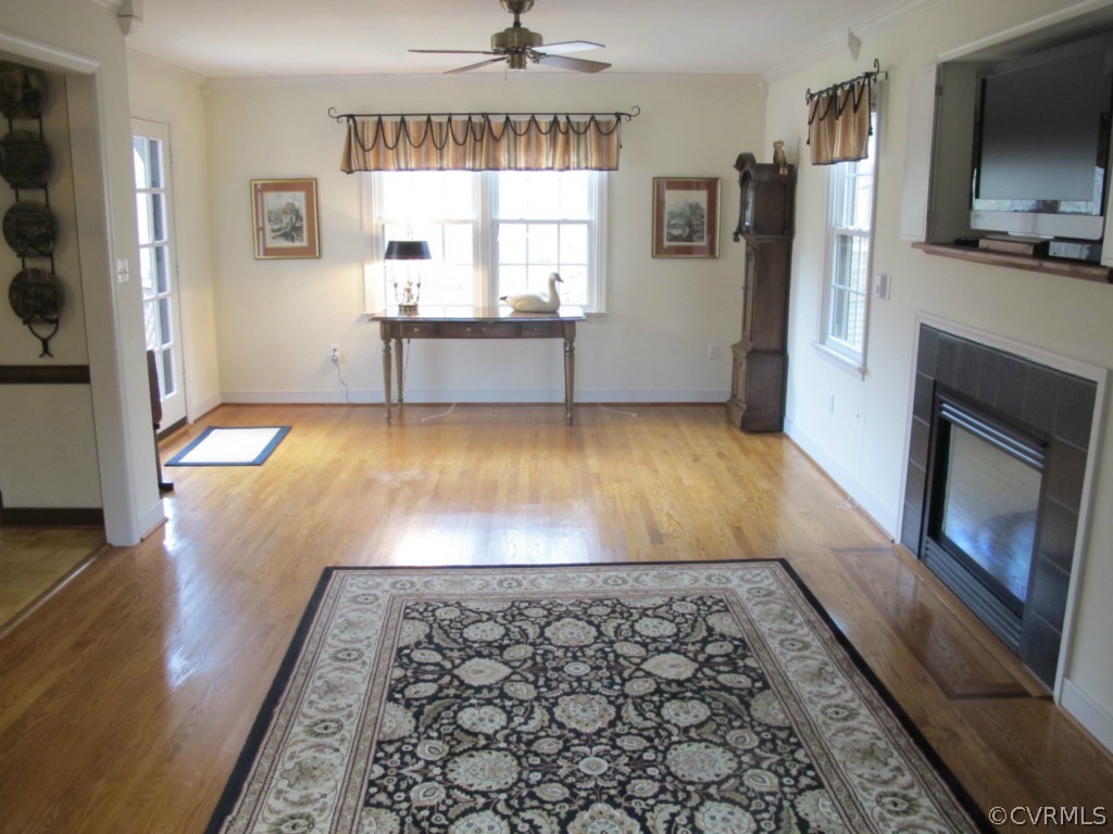 3815 Cresthill Road Chester, VA 23831 - Photo 9 of 24 a view of a kitchen with wooden floor and a fireplace