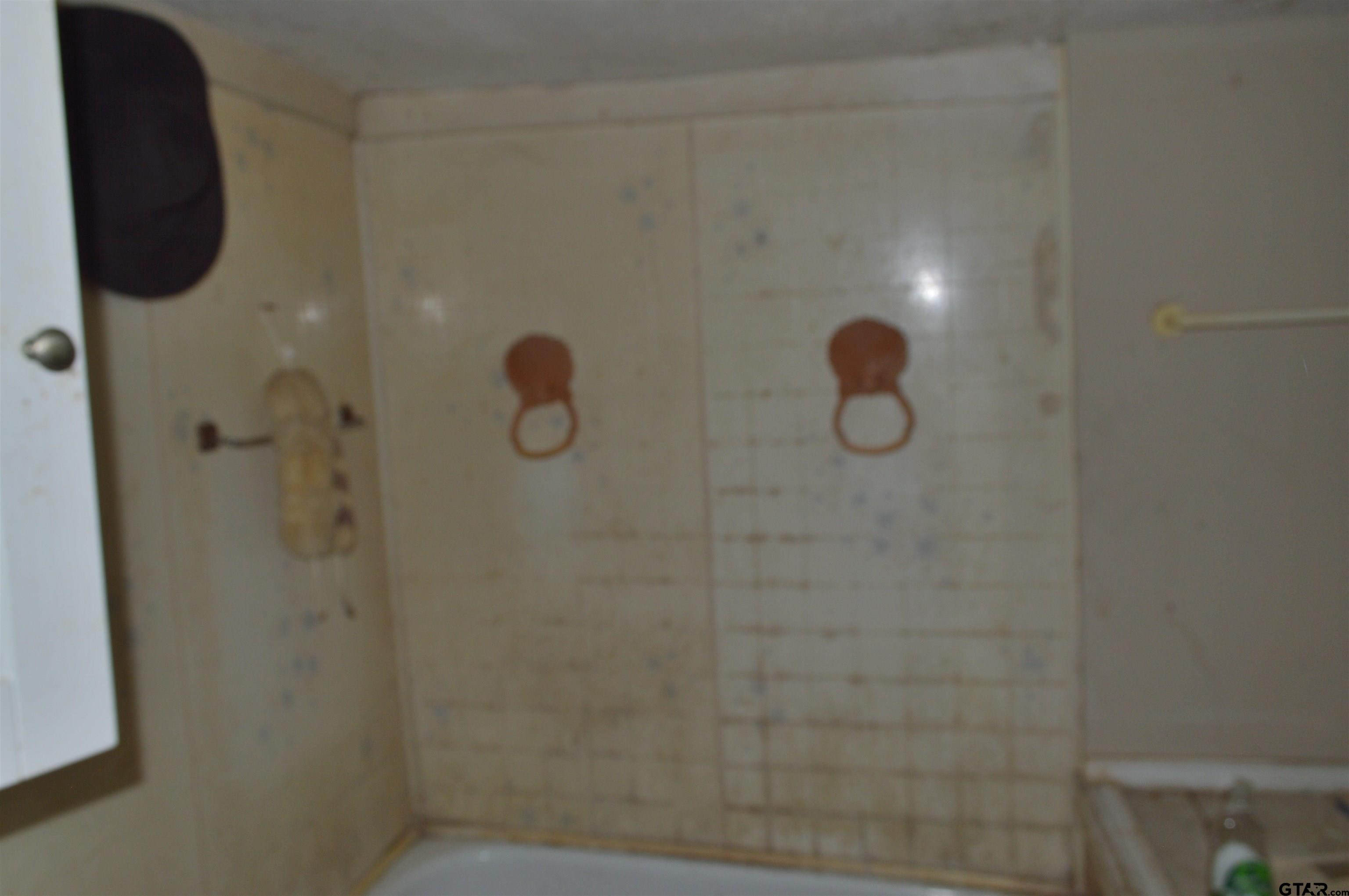 3210 Bellwood Road Tyler, TX 75701 - Photo 11 of 18 a bathroom with a shower