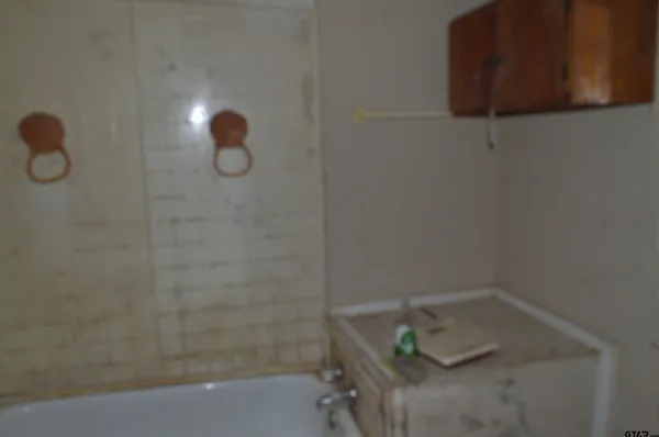 a bathroom with a sink and a shower