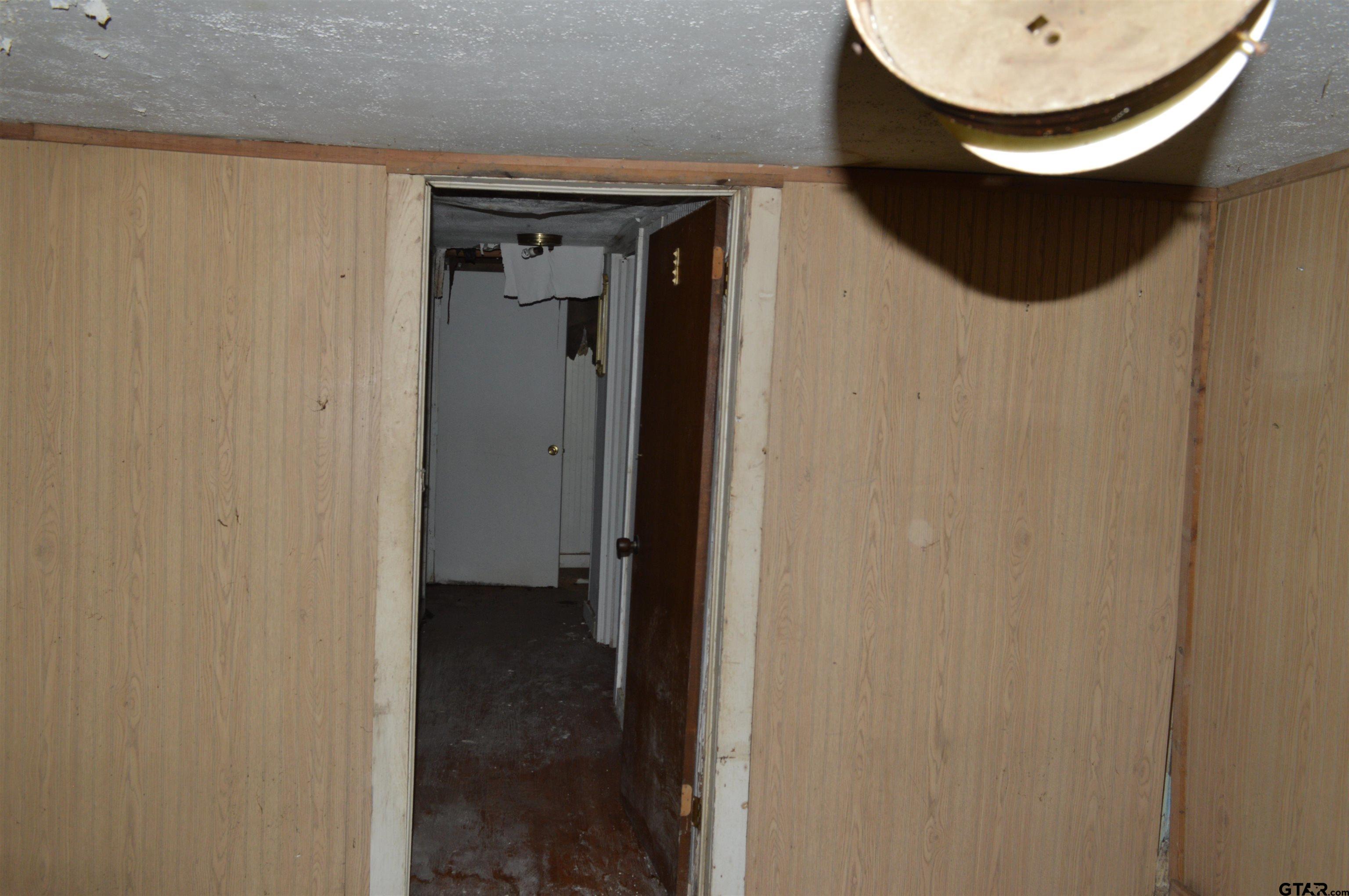 3210 Bellwood Road Tyler, TX 75701 - Photo 18 of 18 a bathroom with a sink and a mirror