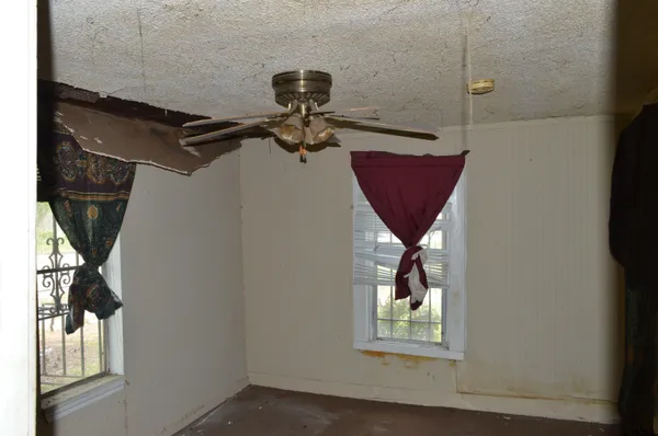 a kitchen with sink refrigerator and window
