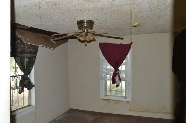 a kitchen with sink refrigerator and window