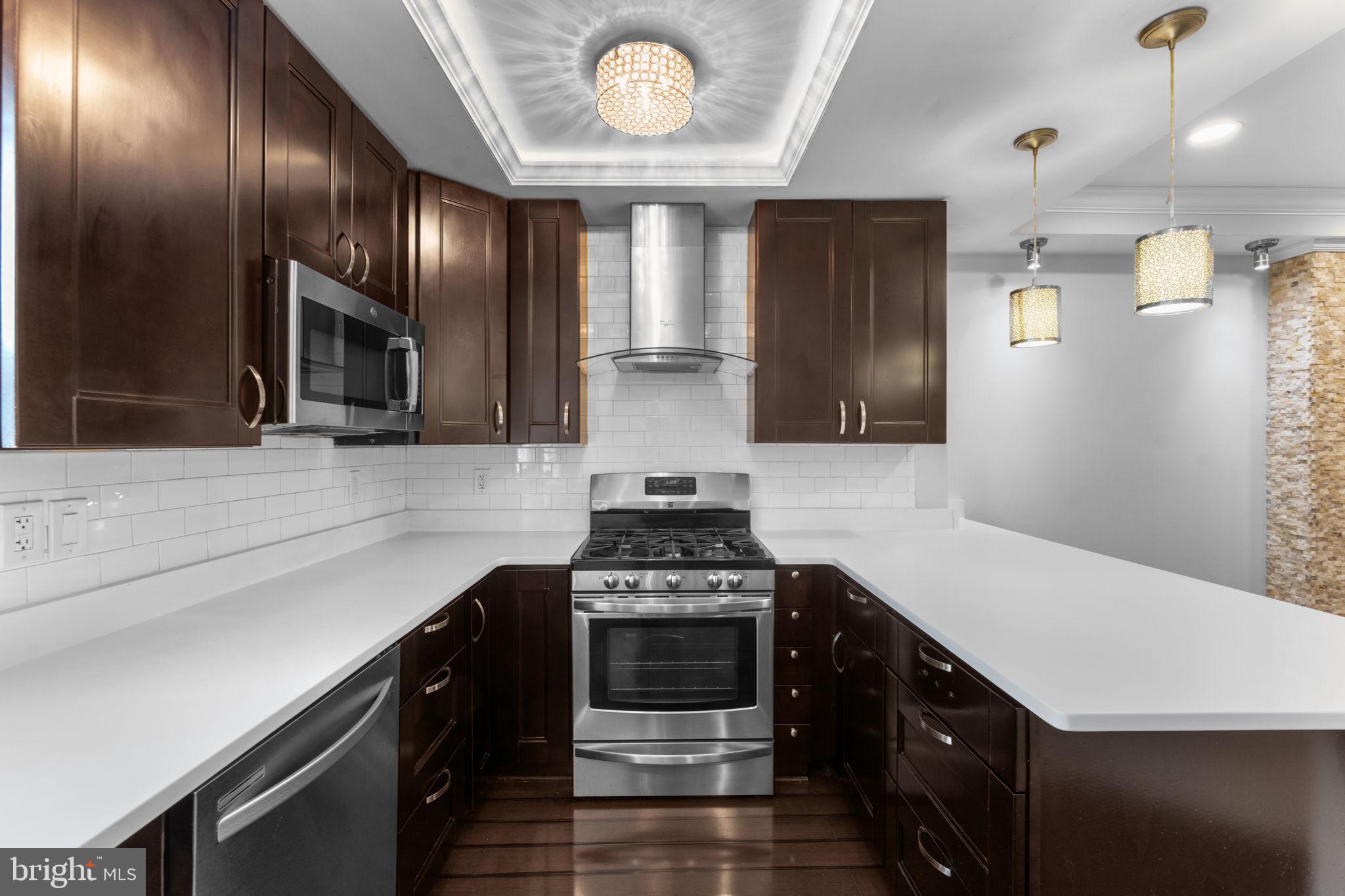 5209 5th Street Northwest Washington, DC 20011 - Photo 13 of 47 a kitchen with a stove and a refrigerator