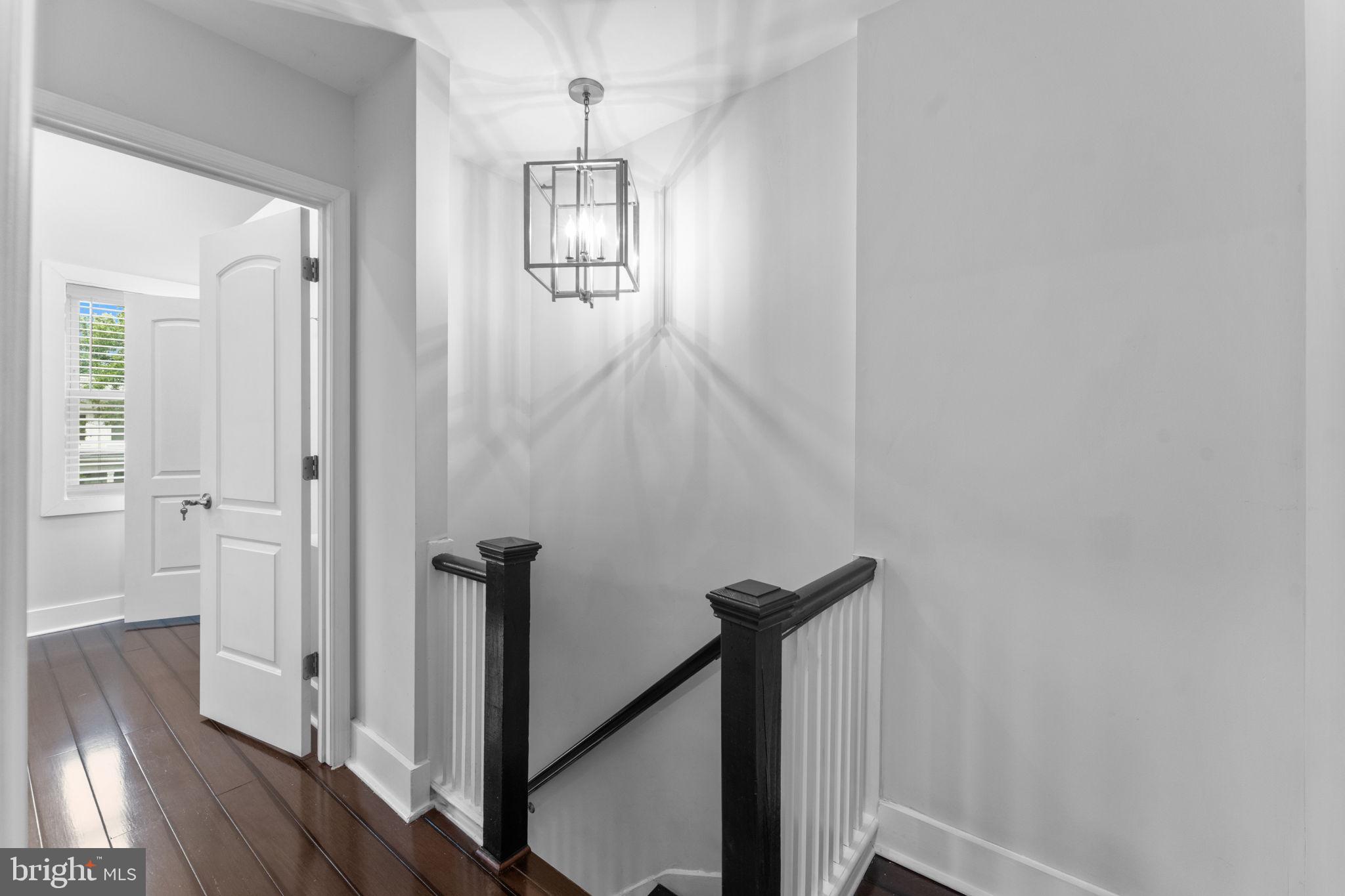 5209 5th Street Northwest Washington, DC 20011 - Photo 23 of 47 a view of a hallway with wooden floor and stairs
