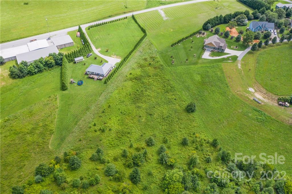 1181 Ridge Road Hendersonville, NC 28792 - Photo 3 of 9 an aerial view of a house with a garden and swimming pool