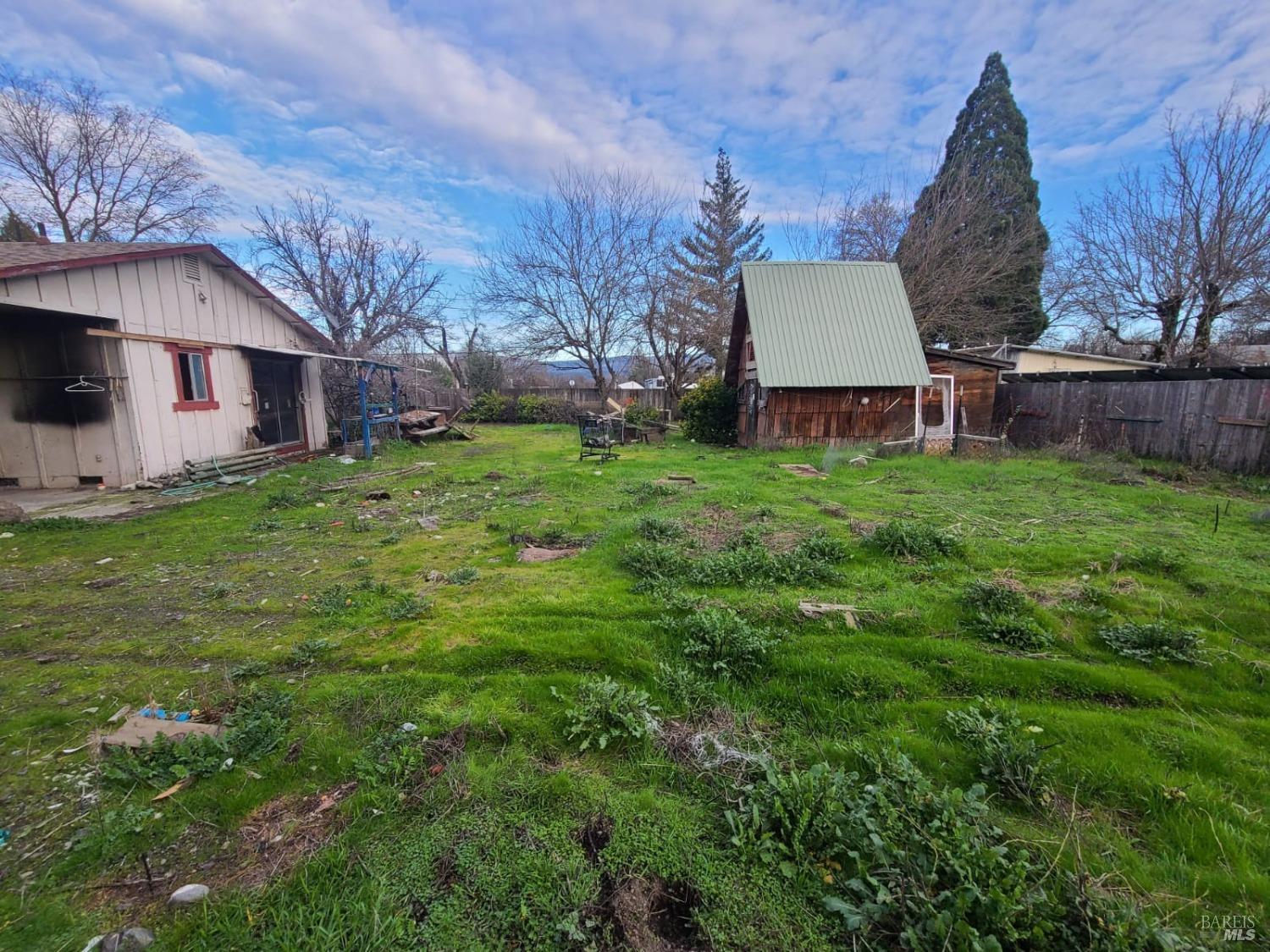 23975 Eberle Street Covelo, CA 95428 - Photo 2 of 13 a house view with a garden space