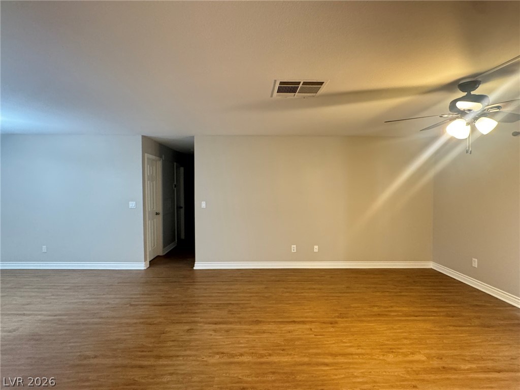 5141 South Lindell Road, Unit 102 Las Vegas, NV 89118 - Photo 6 of 17 A spacious common area with beautiful hardwood flooring provides a versatile living space.