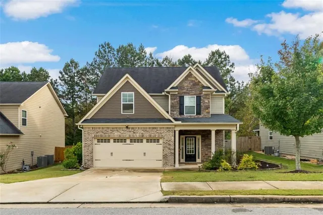 a front view of a house with a yard