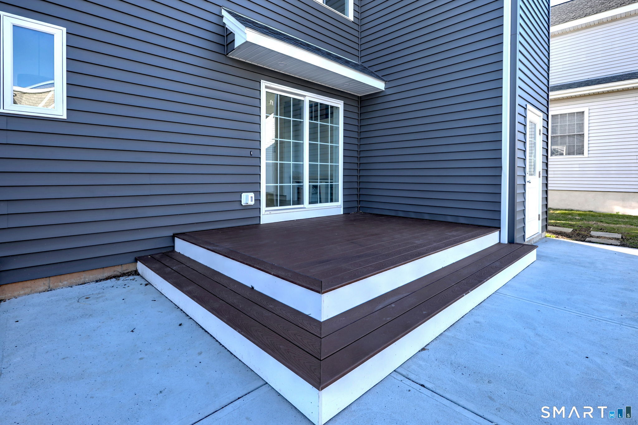 12 Usher Street Milford, CT 06460 - Photo 12 of 46 a view of a backyard with a chair and wooden floor