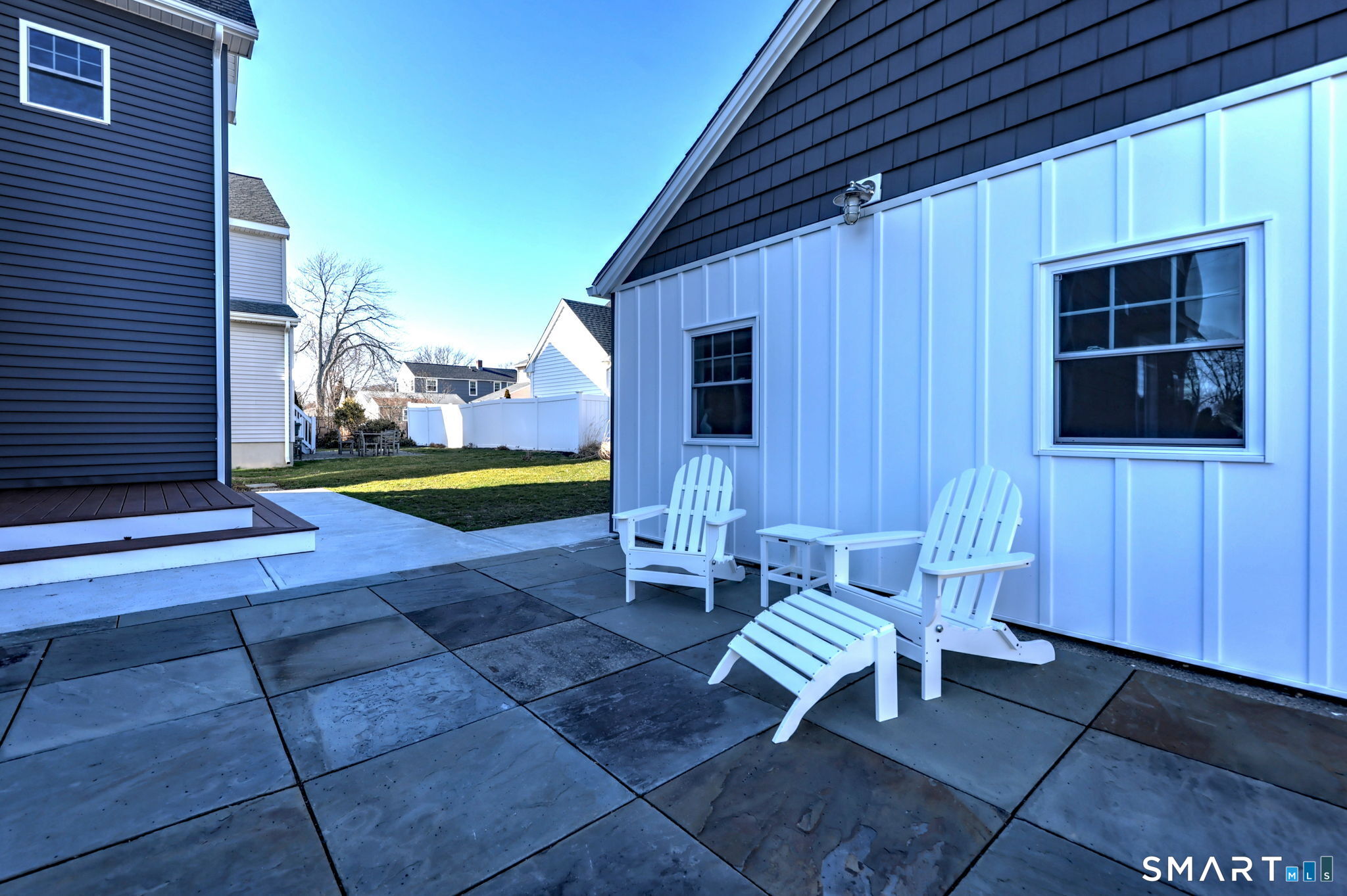 12 Usher Street Milford, CT 06460 - Photo 13 of 46 a view of a patio with a table and chairs