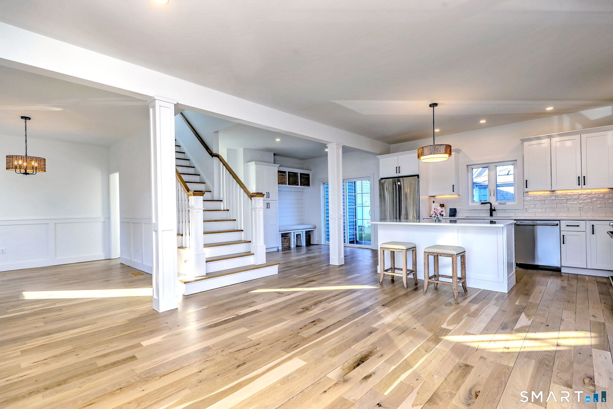 12 Usher Street Milford, CT 06460 - Photo 17 of 46 a view of a kitchen with dining room and wooden floor