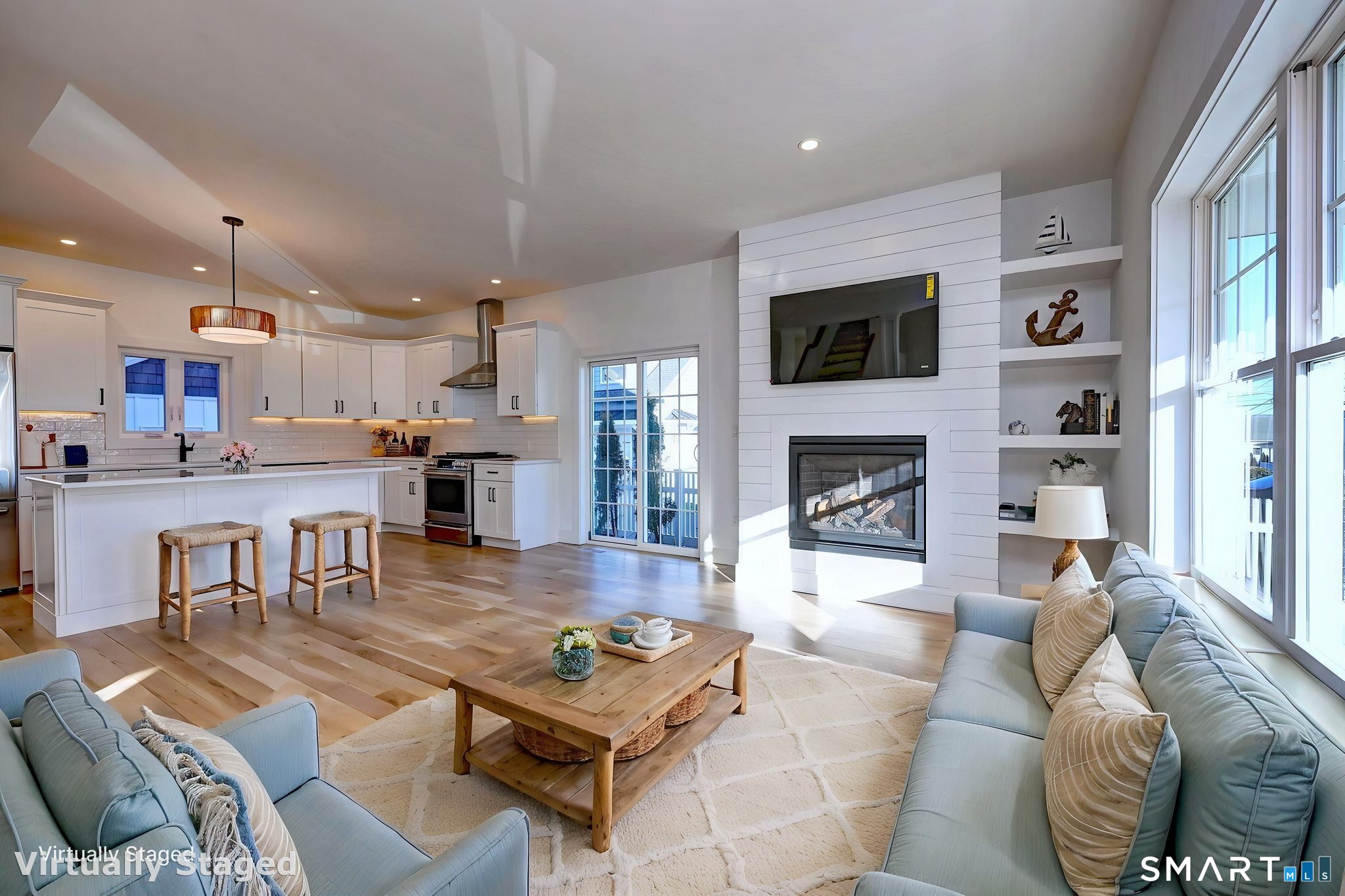 12 Usher Street Milford, CT 06460 - Photo 18 of 46 a living room with furniture and a fireplace