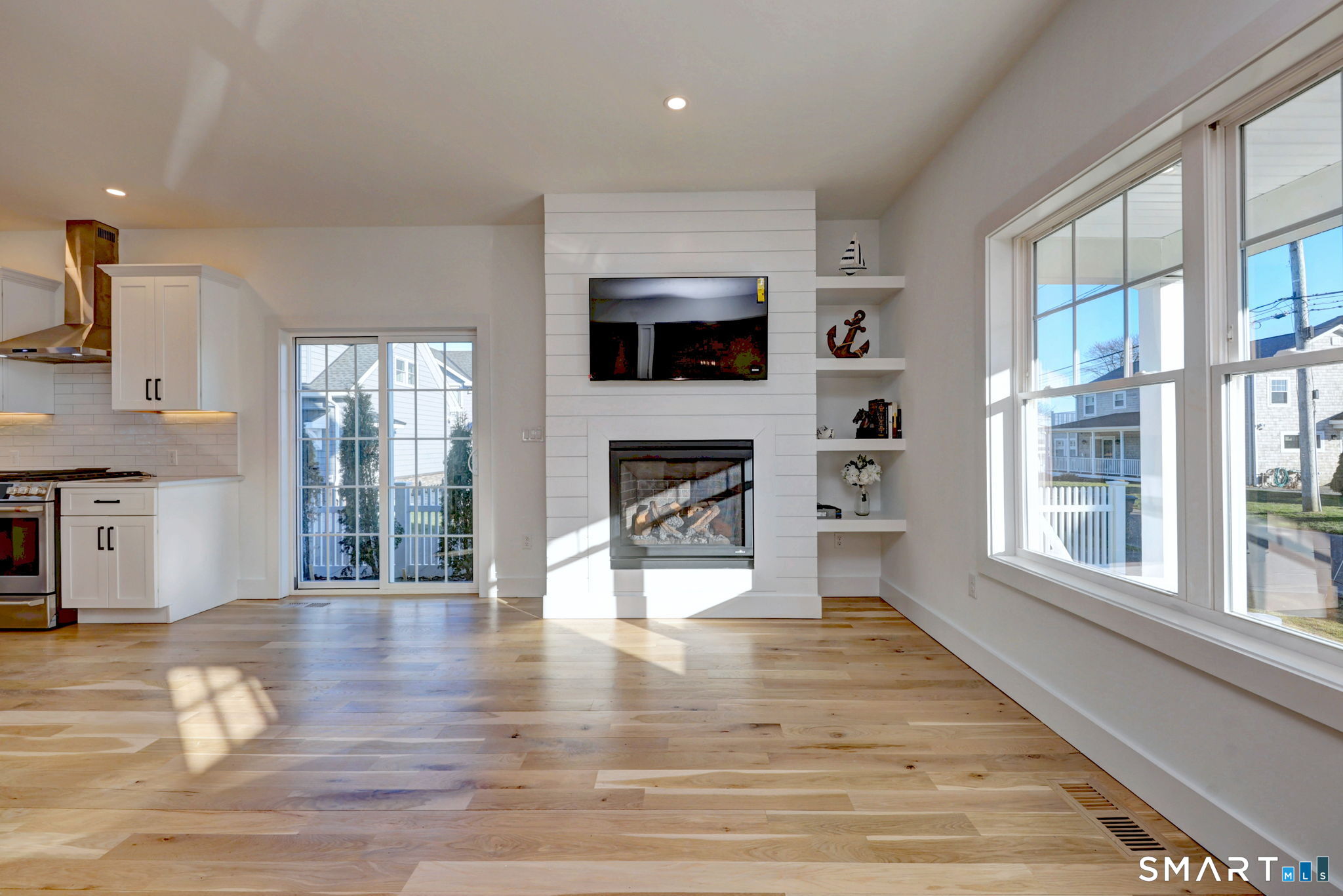 12 Usher Street Milford, CT 06460 - Photo 19 of 46 a living room with fireplace furniture and a flat screen tv