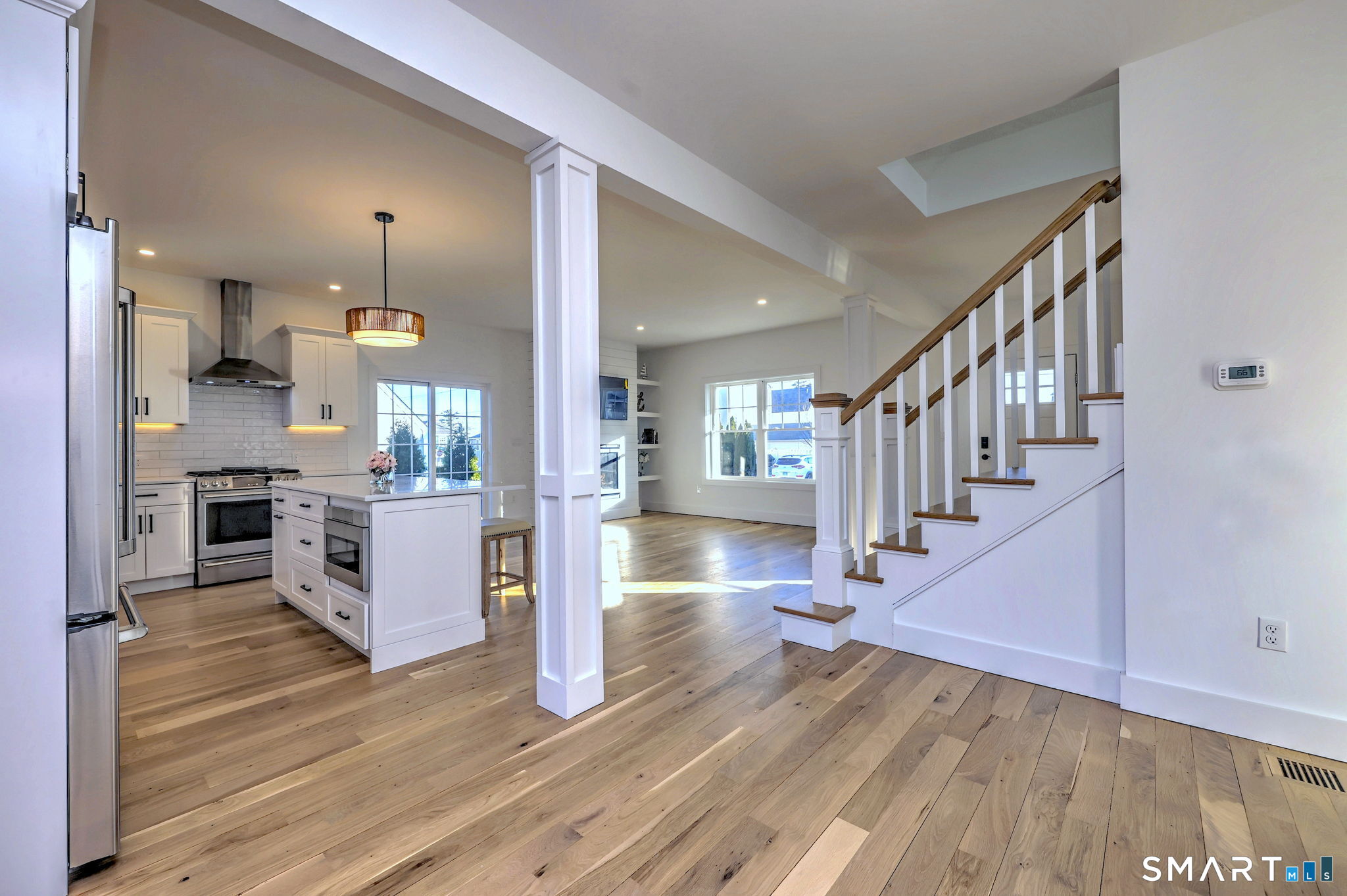12 Usher Street Milford, CT 06460 - Photo 20 of 46 a view of kitchen with cabinets and wooden floor