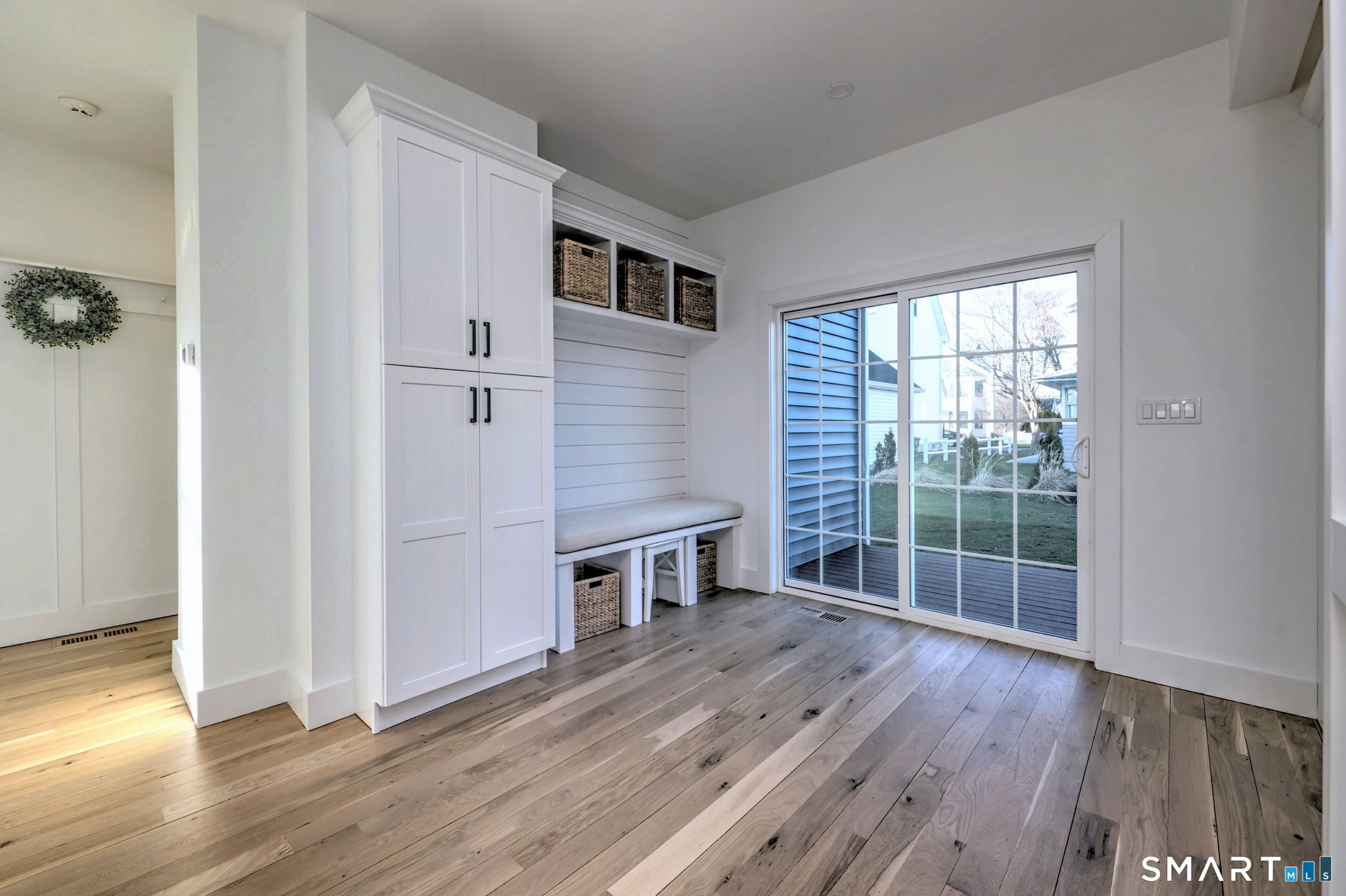 12 Usher Street Milford, CT 06460 - Photo 24 of 46 an empty room with wooden floor and windows