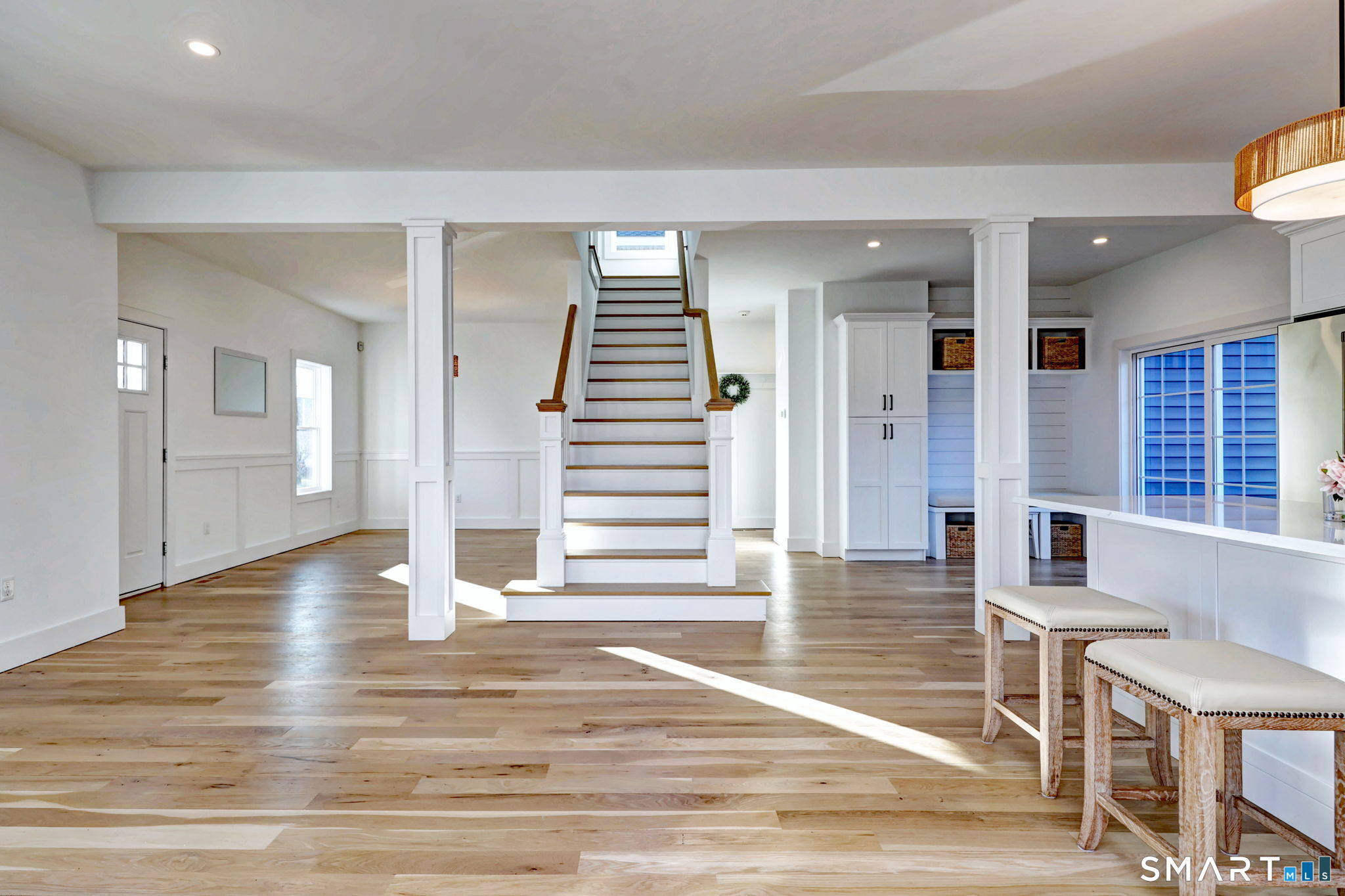 12 Usher Street Milford, CT 06460 - Photo 25 of 46 a view of a livingroom with wooden floor and stairs