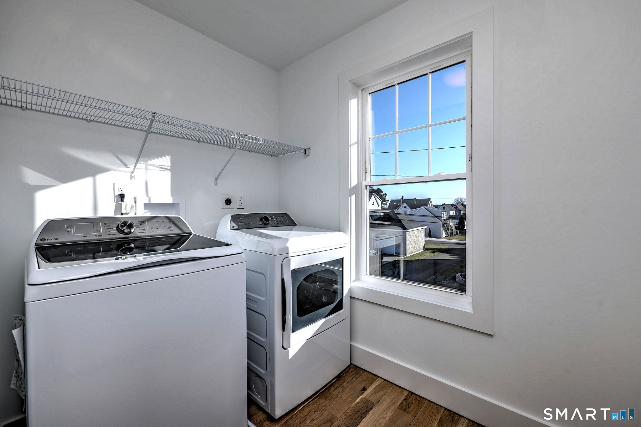 12 Usher Street Milford, CT 06460 - Photo 27 of 46 a utility room with dryer and washer