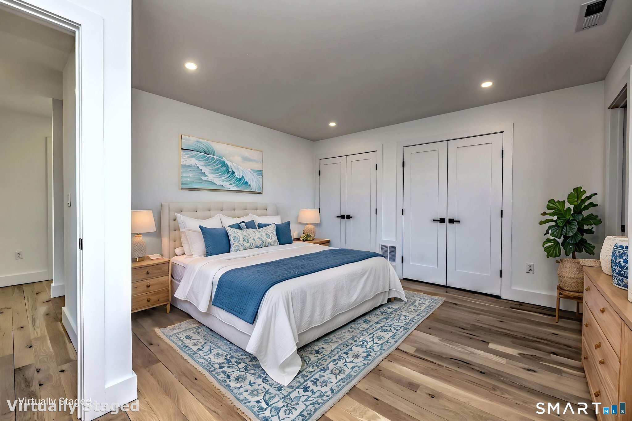 12 Usher Street Milford, CT 06460 - Photo 29 of 46 a bedroom with a large bed and a potted plant