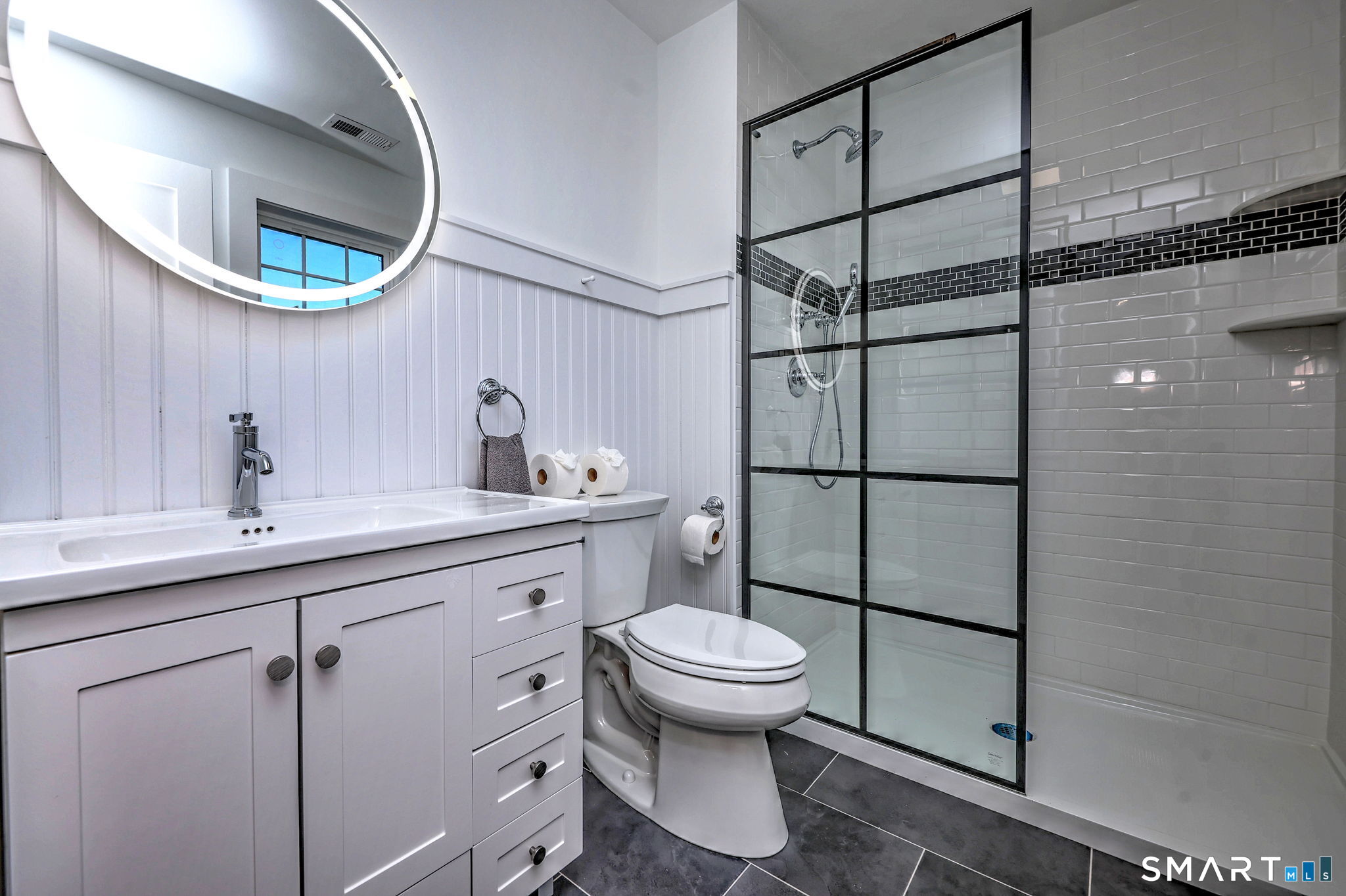 12 Usher Street Milford, CT 06460 - Photo 30 of 46 a bathroom with a toilet sink and mirror