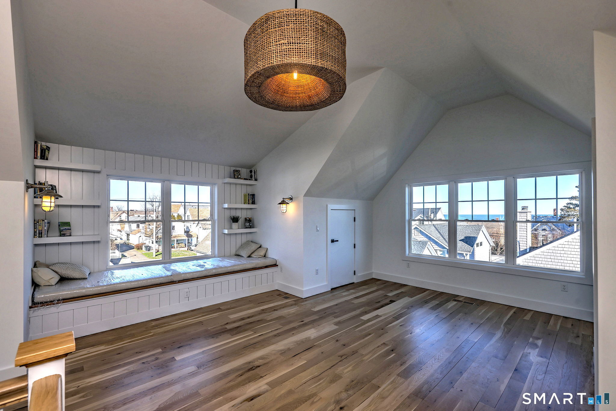 12 Usher Street Milford, CT 06460 - Photo 36 of 46 an empty room with wooden floor and windows