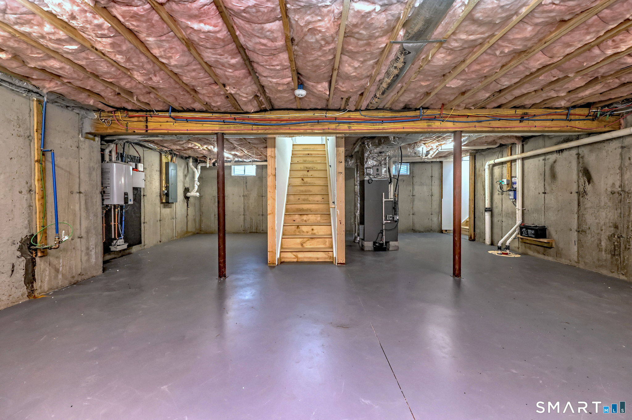 12 Usher Street Milford, CT 06460 - Photo 45 of 46 a view of a hallway with wooden walls