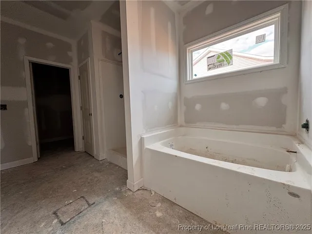 a kitchen with white cabinets