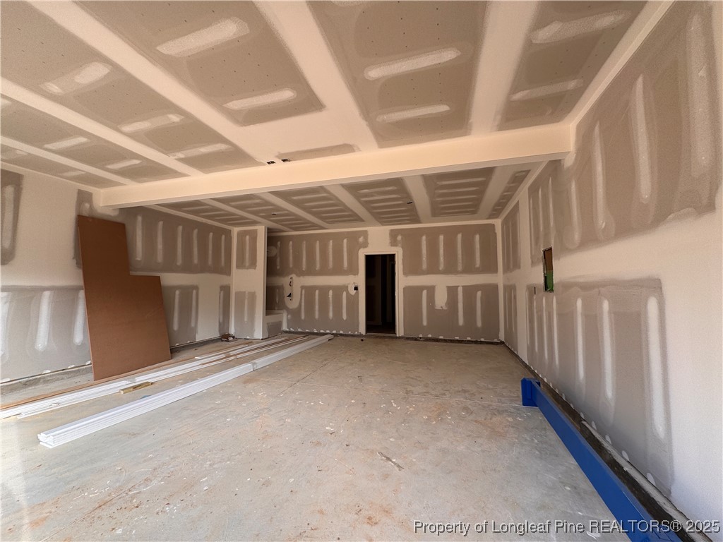 128 Michter Street Vass, NC 28394 - Photo 21 of 21 a view of an empty room with wooden stairs