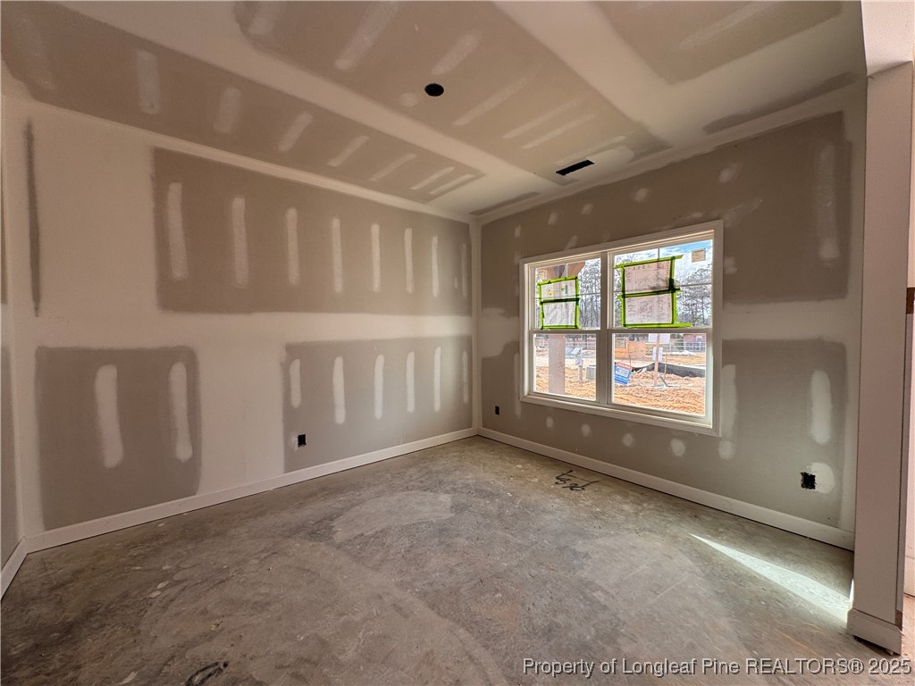 128 Michter Street Vass, NC 28394 - Photo 8 of 21 a view of an empty room with a window
