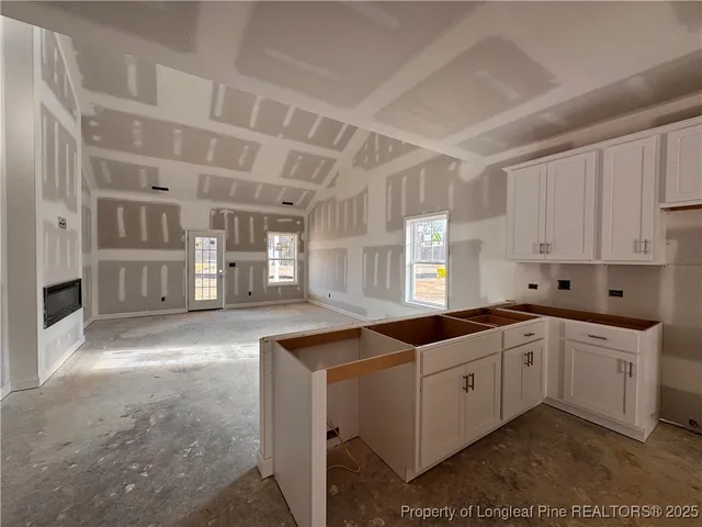 a view of livingroom with furniture and a window
