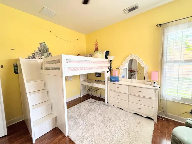 a view of a livingroom with workspace and a window