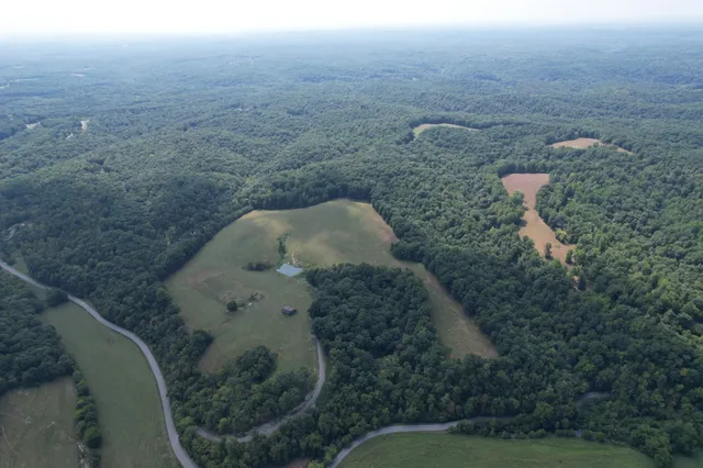 a tall building with trees in front of it