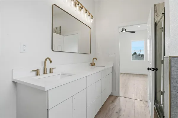 a bathroom with a tub and shower