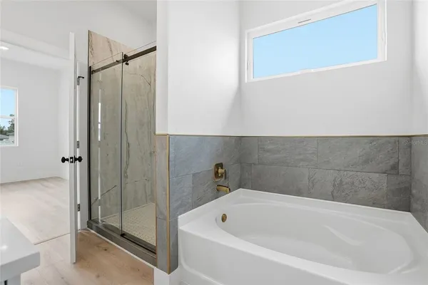 a white bath tub sitting in a bathroom