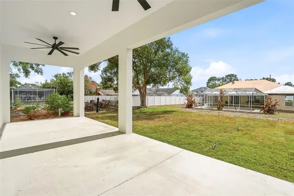 a view of a house with yard and sitting area